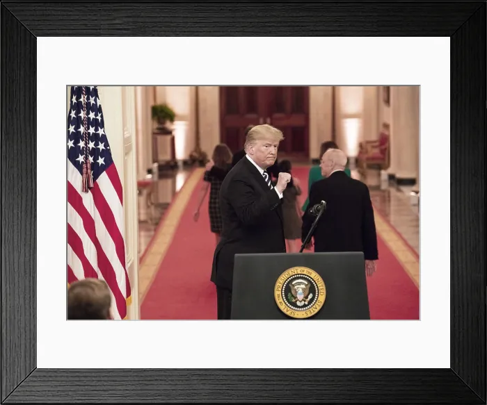 Framed Print : President Donald Trump gestures with a fist pump at the conclusion of the swearing-in ceremony for Supreme Court Associate Justice Brett Kavanaugh. Monday, Oct