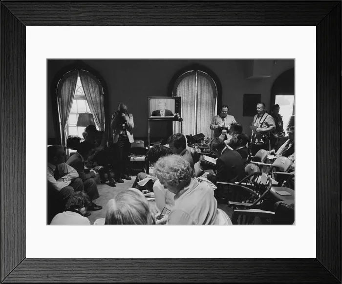 Framed Print : Reporters watch President Carter's television announcement of the aborted Iran Hostages rescue attempt