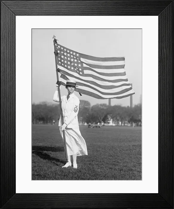 Framed Print : World War 1 era US Navy Yeoman in white summer dress holding American Flag, 1916-1919. Yeomen performed administrative and clerical work (BSLOC_2016_13_116.jpg ) Framed Print : World War 1 era US Navy Yeoman in white summer dress holding American Flag, 1916-1919. Yeomen performed administrative and clerical work (BSLOC_2016_13_116.jpg )