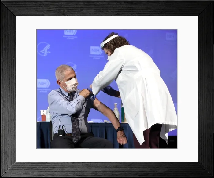 Framed Print : Dr. Anthony Fauci, rolls up his sleeve to publicly receive the Moderna COVID-19 vaccine, Dec. 22, 2020 (BSLOC_2021_1_18)