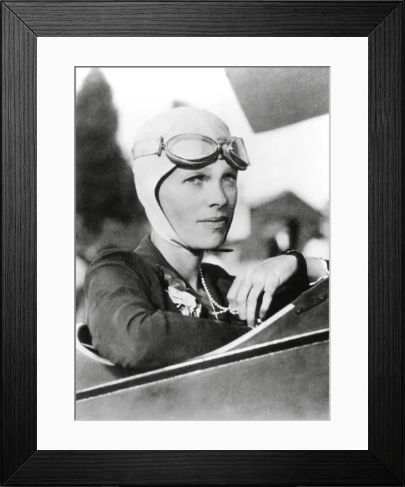 Framed Print : Amelia Earhart, record breaking women aviator in the cockpit of her plane, wearing goggles and close-fitting cloth helmet, ca. 1925-1930 (BSLOC_2021_3_1)