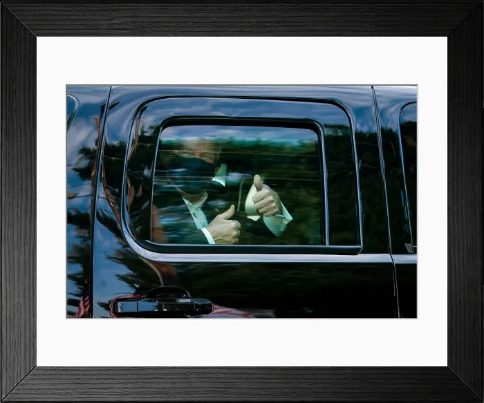 Framed Print : President Donald Trump gestures thumbs up to his supporters during a drive outside of Walter Reed Medical Center during his hospitalization for a COVID-19 disease on, Oct