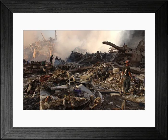 Framed Print : Workers attack the pile of twisted steel and rubble to clear debris from the smoldering wreckage of the World Trade Center two days after the 9-11 terrorist attacks, September 13 Framed Print : Workers attack the pile of twisted steel and rubble to clear debris from the smoldering wreckage of the World Trade Center two days after the 9-11 terrorist attacks, September 13