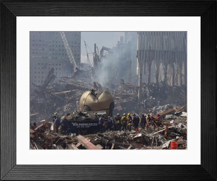 Framed Print : Rescue crews amid the debris of the World Trade Center including THE SPHERE a sculpture by German sculptor Fritz Koenig. Sept. 21 2001. Photo: Everett Collection