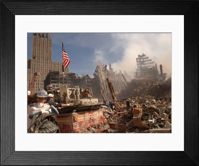 Framed Print : Urban search and rescue teams inspect the wreckage at the World Trade Center two days after the 9-11 terrorist attacks on Sept. 13 2001
