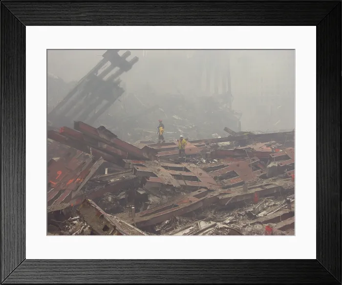 Framed Print : Rescue workers walk over The Pile of the ruins of the World Trade Center. Sept. 20 2001. Photo: Everett Collection