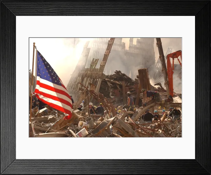 Framed Print : Rescue workers climb over and dig through piles of rubble from the destroyed World Trade Center as the American flag billows over the debris. Sept. 19 2001 Framed Print : Rescue workers climb over and dig through piles of rubble from the destroyed World Trade Center as the American flag billows over the debris. Sept. 19 2001