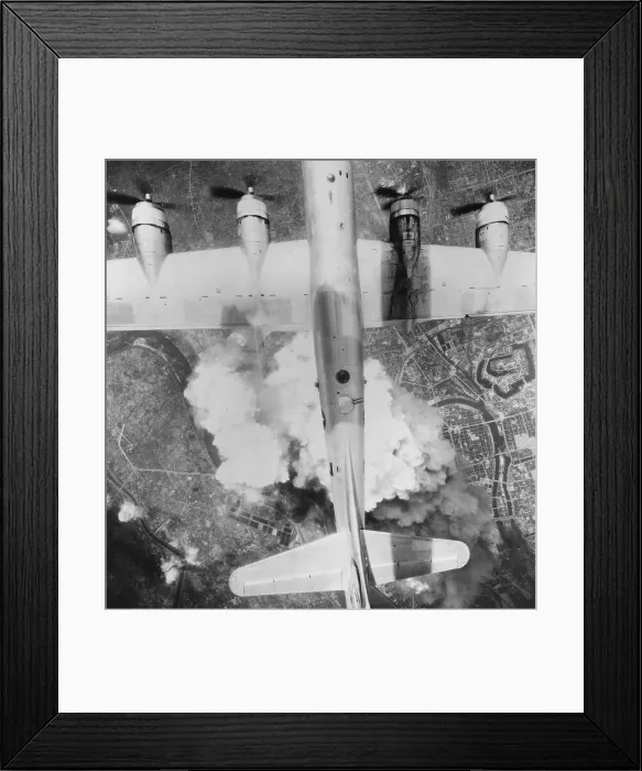 Framed Print : B-29 Superfortress over Osaka, Japan on June 1, 1945. Thousands of incendiary bombs were dropped into the city's industrial area during the last year of World War 2