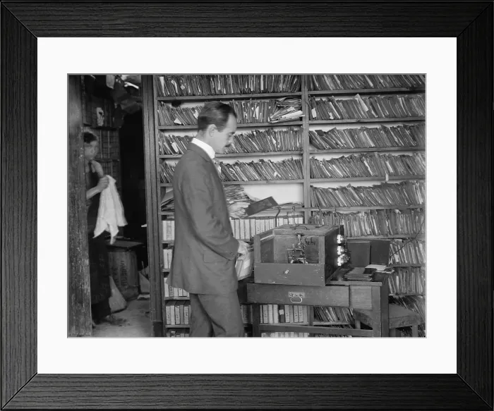 Framed Print : George Bain printing news photographs for his media subscribers in New York City, c. 1910-1915