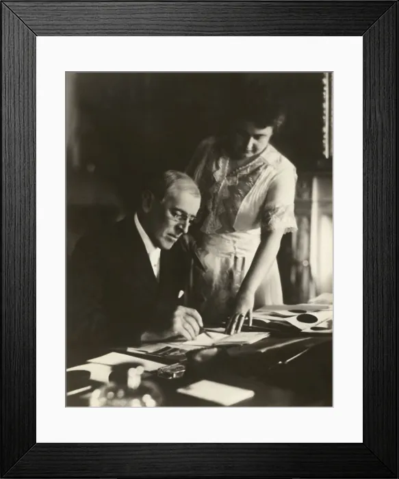 Framed Print : President Woodrow Wilson, at his White House desk, with his wife, Edith Bolling Galt, at his side