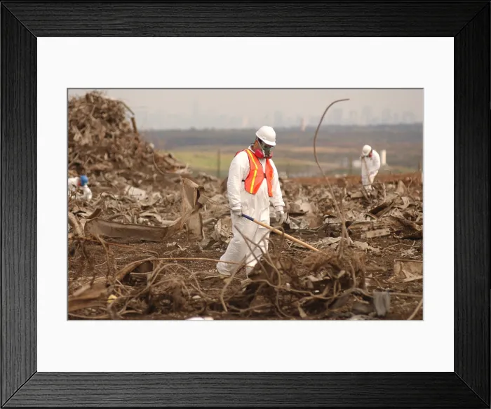 Framed Print : Workers at the Fresh Kills Landfill gather debris from the World Trade Center for victim identification and evidence related to the attack. Oct. 16 2001. Photo: Everett Collection