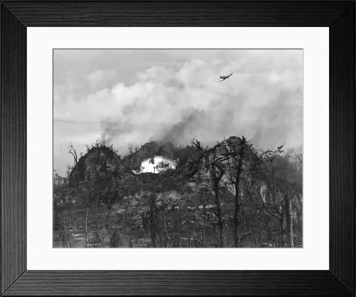 Framed Print : U.S. airplane drop bombs on the enemy area in the hills of Peleliu Island. Sept.-Nov. 1944. World War 2, Pacific Ocean. (BSLOC_2013_13_28)