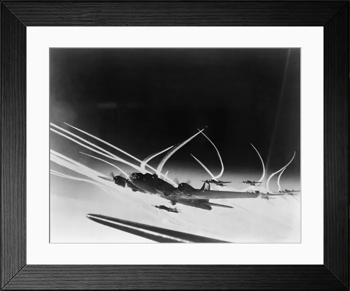 Framed Print : Sub-stratospheric Vapor trails of B-17 Flying Fortresses of the U.S. Army 8th Air Force. The curved trails were made by fighters accompanying the B-17s. World War 2. Ca. 1944