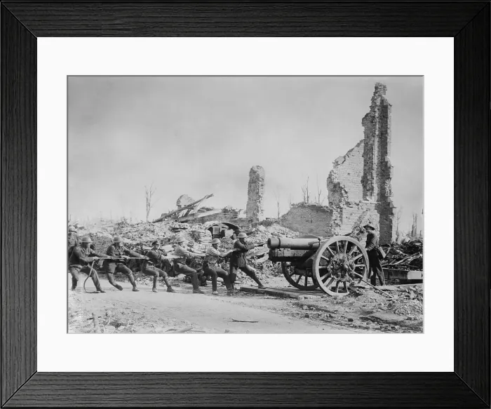 Framed Print : Six British soldiers pull a gun into position amid ruins in France during World War 1. 1915-1918. (BSLOC_2016_13_155.jpg )