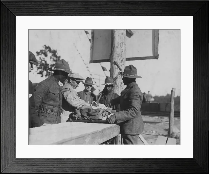 Framed Print : One of over 1900 New York conscripts arriving at Camp Upton, Long Island. Two African American soldiers search their baggage as another stands guard, Sept Framed Print : One of over 1900 New York conscripts arriving at Camp Upton, Long Island. Two African American soldiers search their baggage as another stands guard, Sept