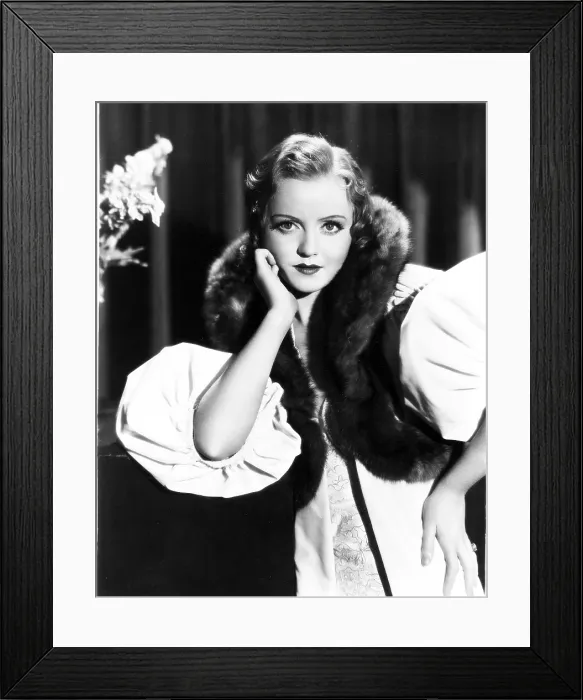 Framed Print : UNDER-COVER MAN, (aka UNDERCOVER MAN), Nancy Carroll, in a white velvet wrap trimmed with sable, 1932