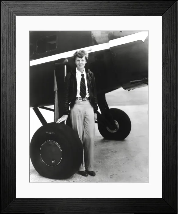 Framed Print : Aviator, Amelia Earhart, standing below her Bright Red Lockheed Vega airplane which she bought in 1929 Framed Print : Aviator, Amelia Earhart, standing below her Bright Red Lockheed Vega airplane which she bought in 1929