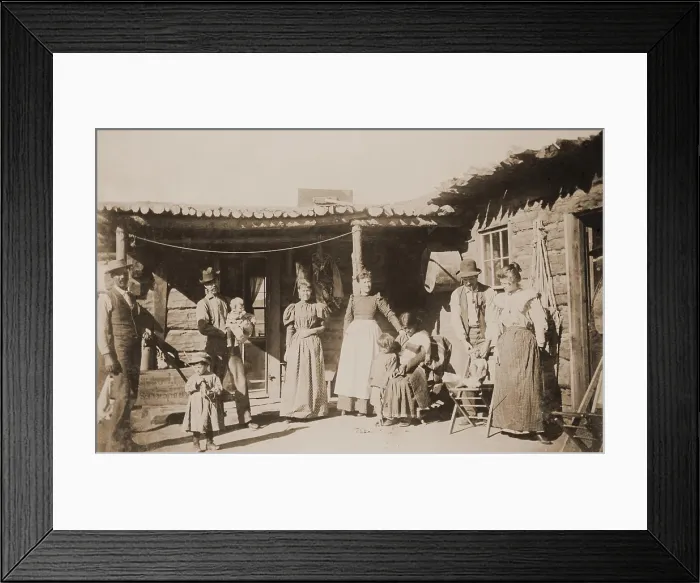 Framed Print : A New Mexican family group poses with dog, a native American woman, and young child, outside a log house in New Mexico Territory, ca. 1895 Framed Print : A New Mexican family group poses with dog, a native American woman, and young child, outside a log house in New Mexico Territory, ca. 1895