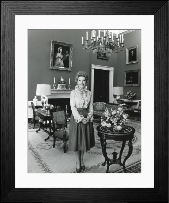 Framed Print : Nancy Reagan poses in the White House Red Room for her official first term portrait. February 7, 1981 (BSLOC_2021_3_23)