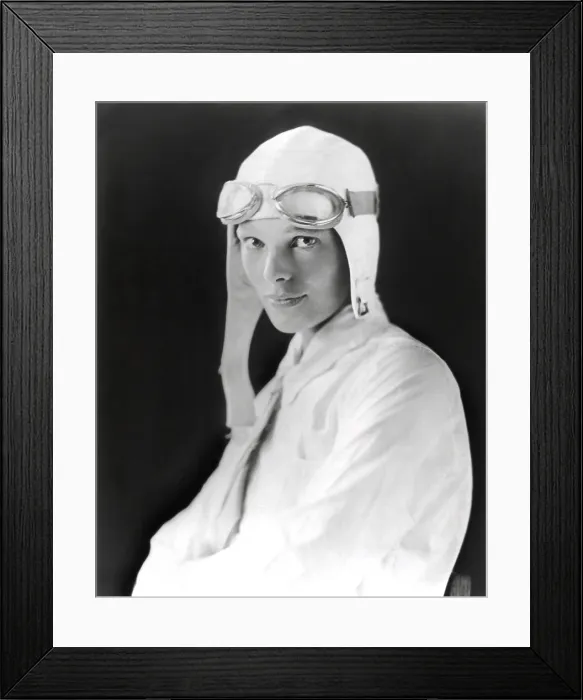 Framed Print : Aviator Amelia Earhart wearing white flying suit, cloth helmet and goggles, ca. 1929 (BSLOC_2021_3_2) Framed Print : Aviator Amelia Earhart wearing white flying suit, cloth helmet and goggles, ca. 1929 (BSLOC_2021_3_2)