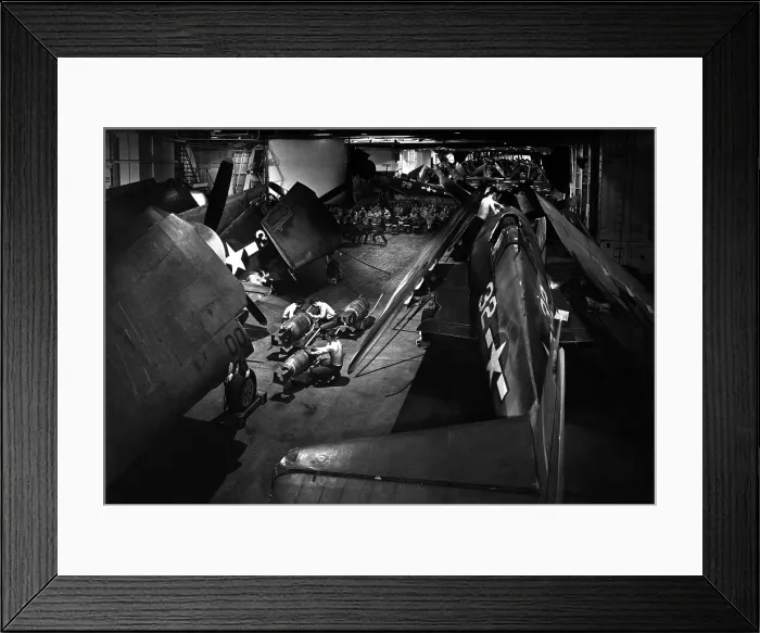 Framed Print : Surrounded by F6F Hellcat fighters, seamen prepare bombs on hangar deck of USS Yorktown. Ca. 1943. World War 2, Pacific Ocean. (BSLOC_2013_13_5)