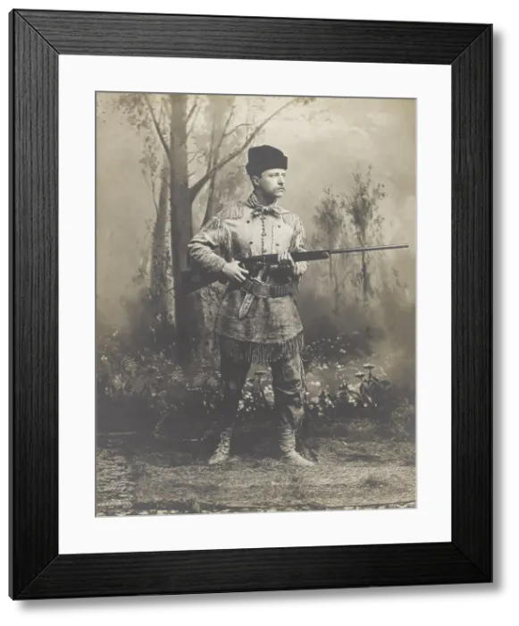 Framed Print : Theodore Roosevelt, in buckskin hunting suit, holding rifle in 1885 studio portrait. He designed the suit himself, which was crafted for him by a Dakotan woman, Mrs Framed Print : Theodore Roosevelt, in buckskin hunting suit, holding rifle in 1885 studio portrait. He designed the suit himself, which was crafted for him by a Dakotan woman, Mrs