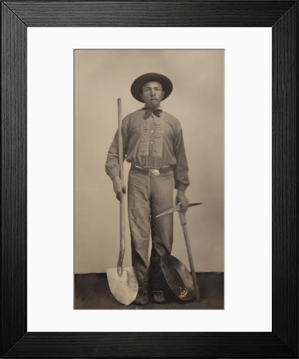 Framed Print : Tintype portrait of a man with his gold mining equipment, a pick, shovel, and shallow metal pan