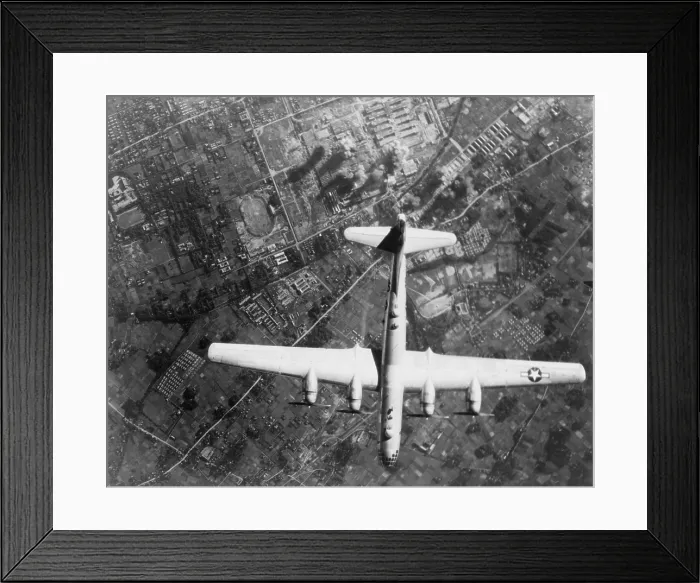 Framed Print : American B-29 Super Fortress bomber over Nakajima Aircraft Co. Musashino Plant, Japan. On the ground, smoke marks it's bombing impacts. 1945. World War 2. (BSLOC_2013_13_75)