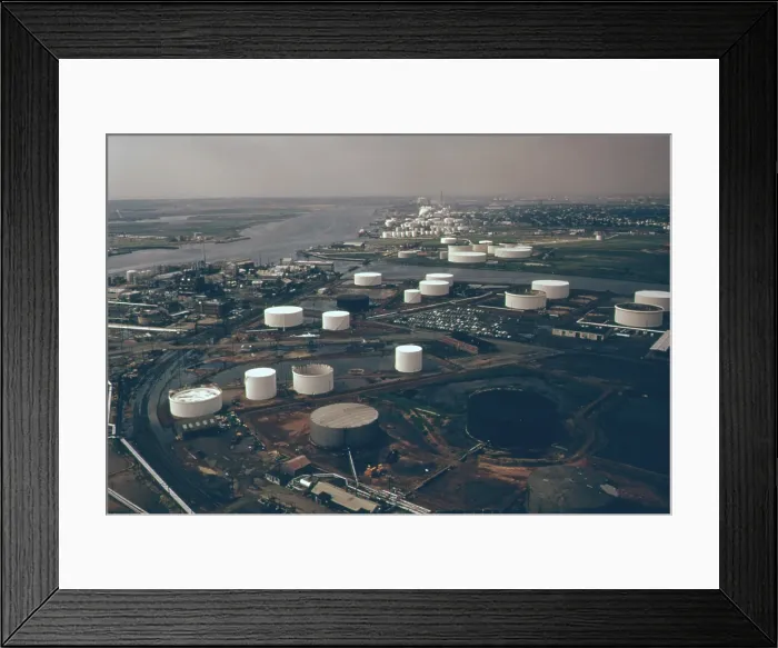 Framed Print : Storage tanks of the American Cyanamid Company manufacturer of chemicals insecticides and sulfuric acid on the Arthur Kill River a tidal channel in New York Harbor