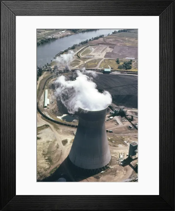 Framed Print : Steam rises from one of the massive cooling towers of the John Amos Power Plant which generates electricity from coal a abundant resource in West Virginia. Ca. 1973-75