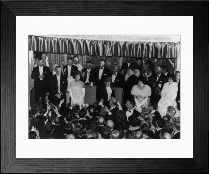 Framed Print : 1960 Inaugural Ball. President Kennedy reaching down to shake hands with a guest at the Mayflower Hotel