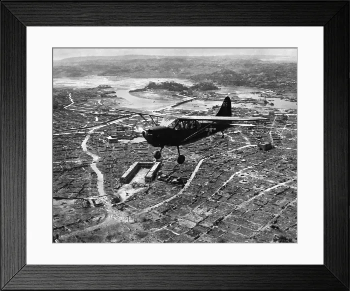 Framed Print : U.S. Marine observation plane flies low over Naha, capital of Okinawa, May 1945 Framed Print : U.S. Marine observation plane flies low over Naha, capital of Okinawa, May 1945