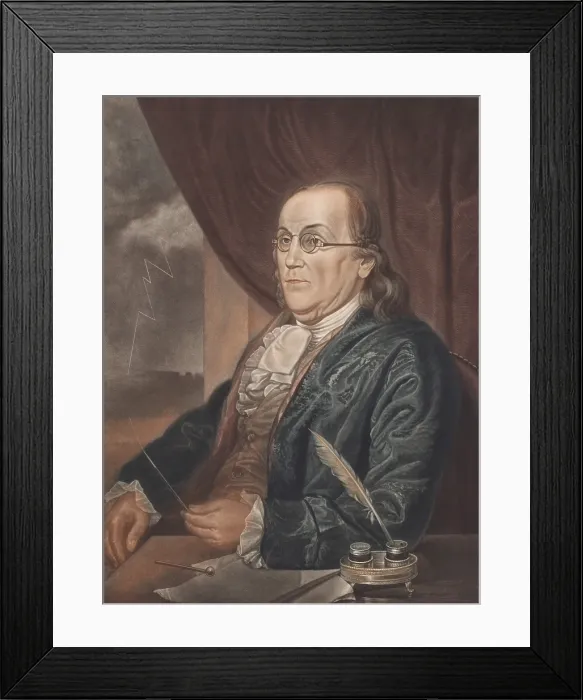 Framed Print : Benjamin Franklin, holds the tip of a pointed lightning rod, while another terminates with a round knob lies on the table before him Framed Print : Benjamin Franklin, holds the tip of a pointed lightning rod, while another terminates with a round knob lies on the table before him