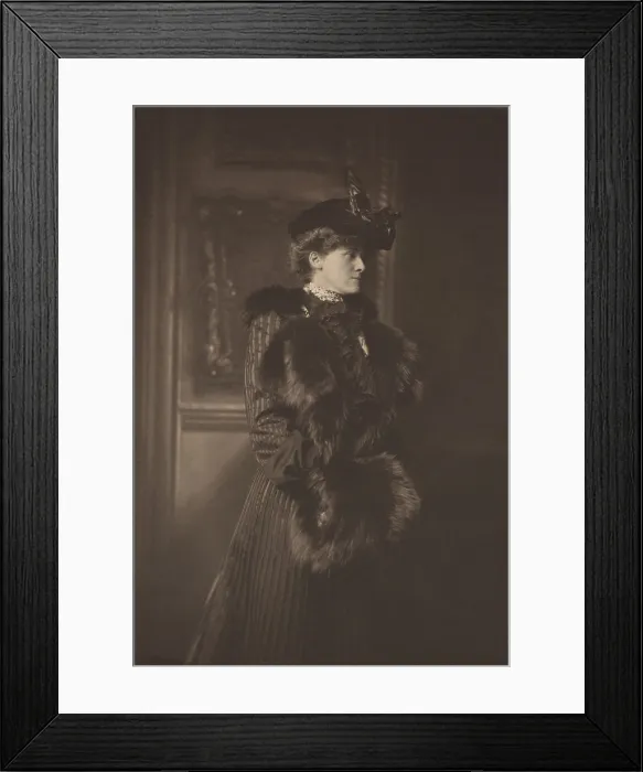 Framed Print : Edith Wharton, wears a feathered hat, a fur-trimmed coat, and a fur muff in Newport, Rhode Island, 1907