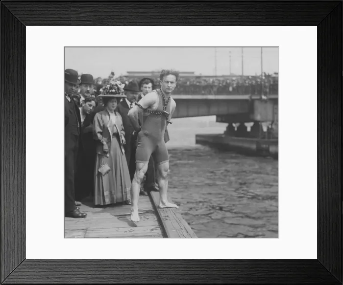 Framed Print : Harry Houdini jumps 30 feet from Harvard Bridge locked up in chains, April 30, 1908. Boston, Massachusetts