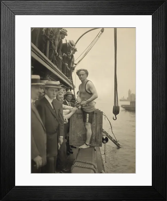Framed Print : Harry Houdini stepping into a crate to be lowered into New York Harbor on July 7, 1912