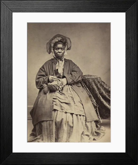 Framed Print : African American woman holding a basket, in a photo taken between 1864-67. The name Charlotte Scott is written in pencil on the photo Framed Print : African American woman holding a basket, in a photo taken between 1864-67. The name Charlotte Scott is written in pencil on the photo