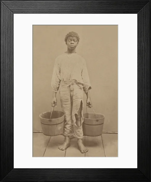 Framed Print : African American youth, possibly a former slave, holding two buckets, c. 1870. Photo by Isaac Haas, Green Cove Springs, Florida (BSLOC_2018_5_91)