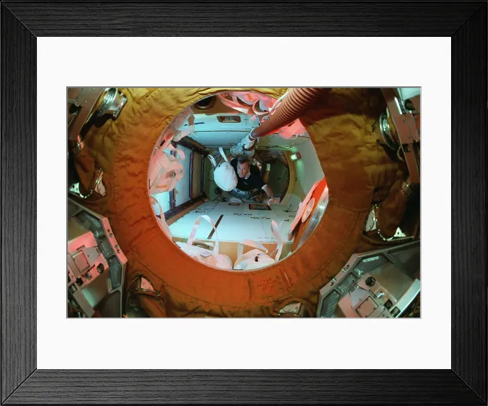 Framed Print : Delivery of water to Russia's Mir Space Station. US space shuttle astronaut, Terrence Wilcutt, brings a water bag to the Mir