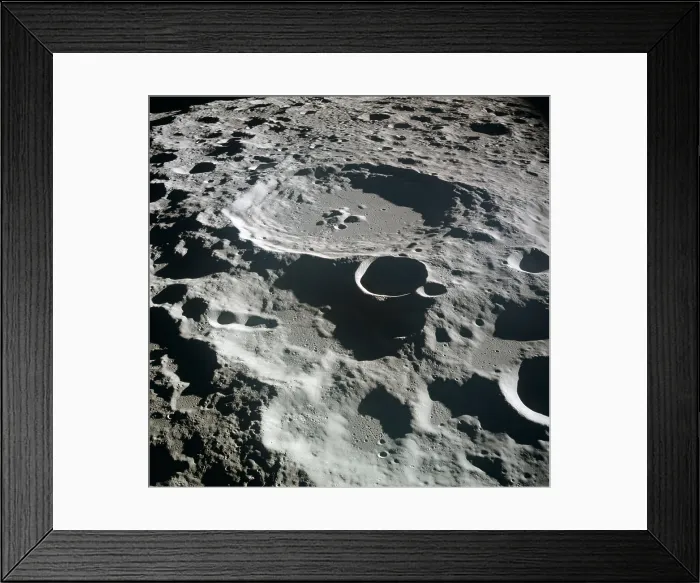 Framed Print : Apollo 11 Moon view. Crater Daedalus on the lunar, has a diameter of about 50 miles and is a typical of the rugged terrain on the far side of the Moon Framed Print : Apollo 11 Moon view. Crater Daedalus on the lunar, has a diameter of about 50 miles and is a typical of the rugged terrain on the far side of the Moon