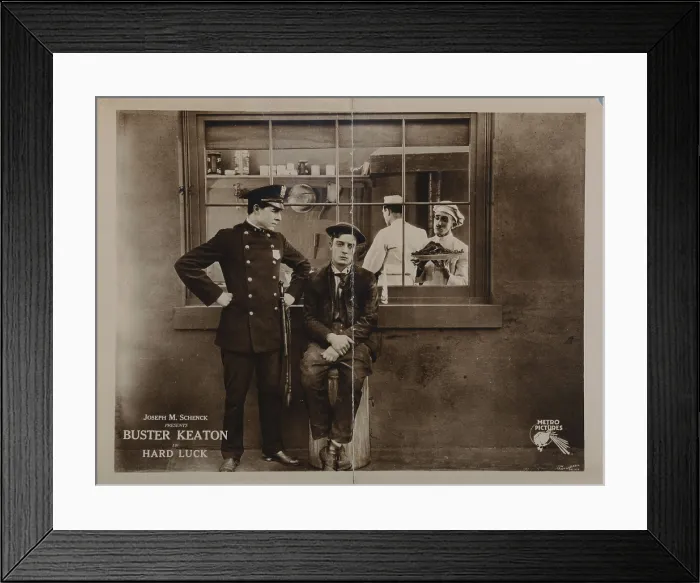 Framed Print : HARD LUCK, lobbycard, Buster Keaton (sitting), 1921