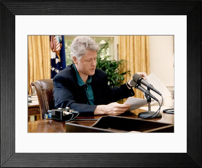 Framed Print : President Bill Clinton delivers his weekly radio address from the White House Oval Office on May 8, 1993