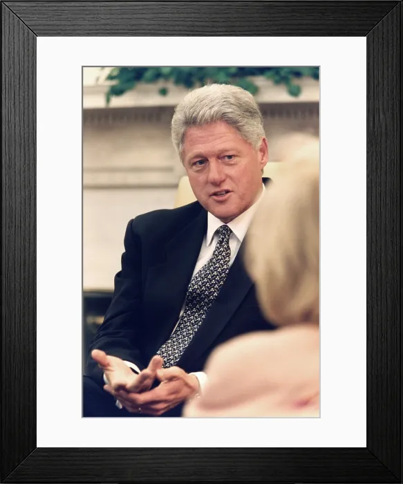 Framed Print : President Bill Clinton speaks with reporters in the Oval Office of the White House, Oct. 1, 1996. His election year opponent was Republican senator Bob Dole (BSLOC_2021_7_12)