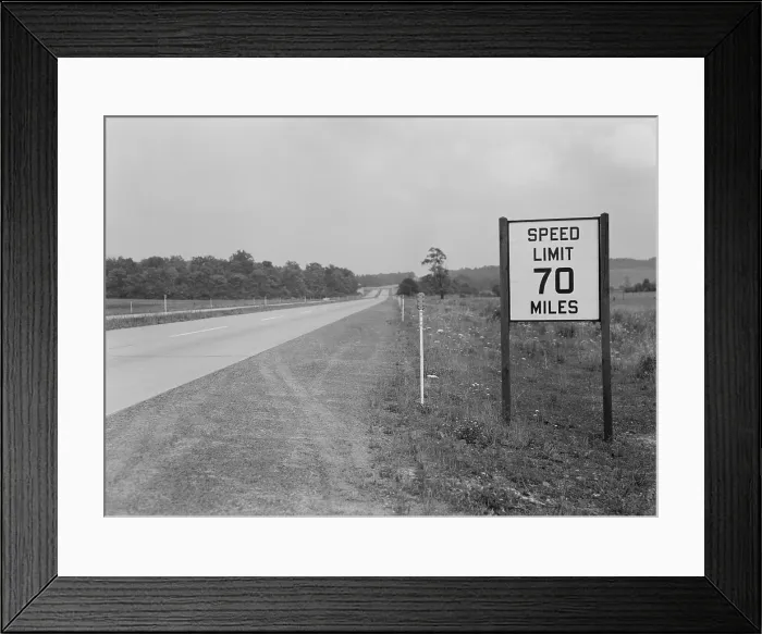 Framed Print : 70 MPH speed limit sign on the empty Pennsylvania Turnpike during World War 2. Before the war, the Turnpike has no speed limits. Sept. 1942. (BSLOC_2013_14_169) Framed Print : 70 MPH speed limit sign on the empty Pennsylvania Turnpike during World War 2. Before the war, the Turnpike has no speed limits. Sept. 1942. (BSLOC_2013_14_169)