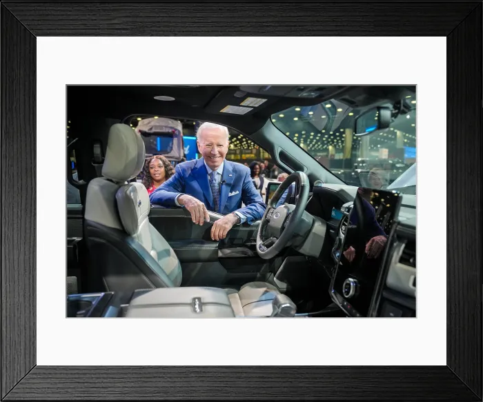 Framed Print : President Joe Biden looks at the Ford F-150 Lighting, a fully electric version of Fords best-selling truck