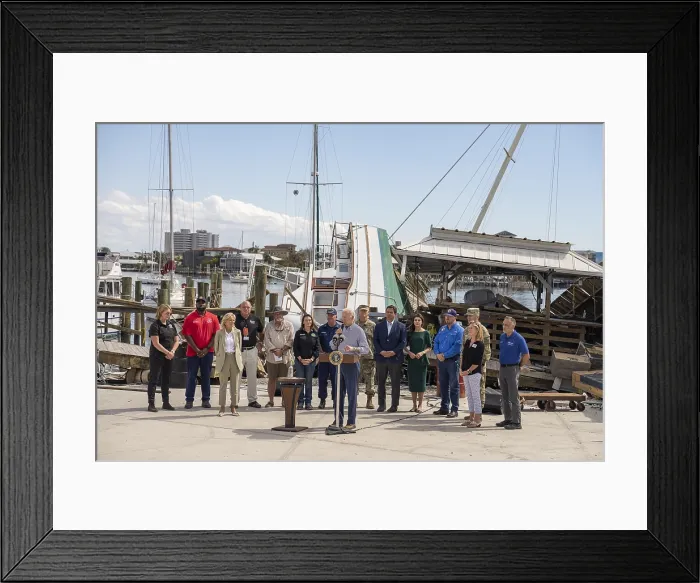Framed Print : President Joe Biden speaks on recovery efforts after Hurricane Ian, at Fisherman's Wharf in Fort Myers, Oct. 5, 2022. Standing behind to the right are Florida Gov
