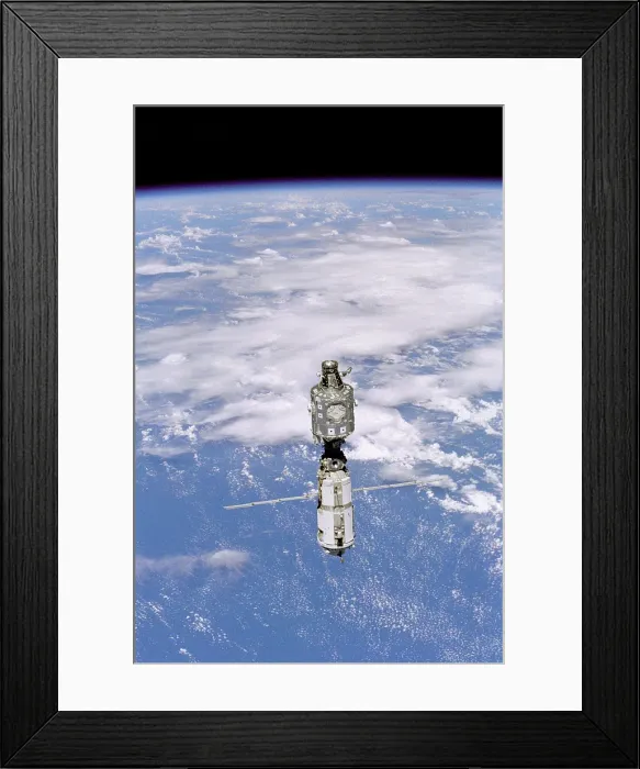 Framed Print : International Space Station in 1999. Photo was made when the Space Shuttle Discovery installed Strela, a Russian built crane. June 3, 1999