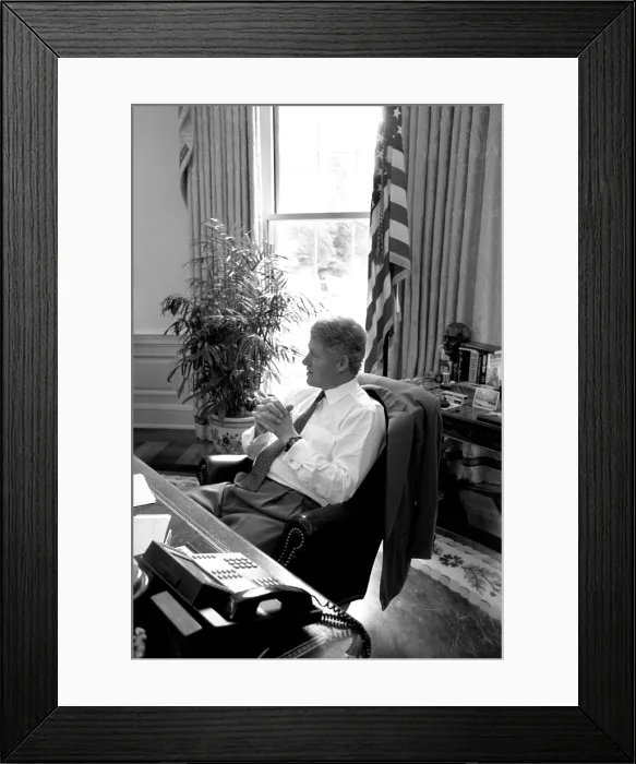 Framed Print : President Bill Clinton in shirtsleeves at his Oval Office desk on August 16 Framed Print : President Bill Clinton in shirtsleeves at his Oval Office desk on August 16