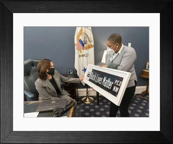 Framed Print : Vice President Kamala Harris is shown a Black Lives Matter street sign by Symone Sanders, Senior Advisor and Chief Spokes Person for the Vice President. Feb Framed Print : Vice President Kamala Harris is shown a Black Lives Matter street sign by Symone Sanders, Senior Advisor and Chief Spokes Person for the Vice President. Feb