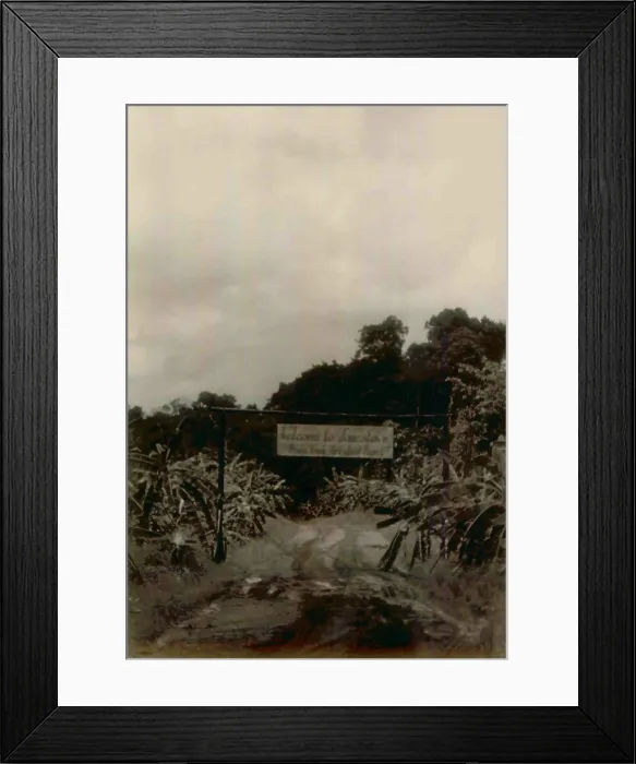 Framed Print : Front Gate Welcome Sign and gate at the beginning of the road into Jonestown. People's Temple Agricultural Project. Jonestown, Guyana. Nov. 1978
